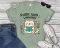 Purr and Unwind cat reading a book T-Shirt