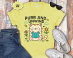 Purr and Unwind cat reading a book T-Shirt