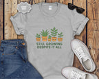Still Growing Despite It All Potted Plants Illustration T-Shirt